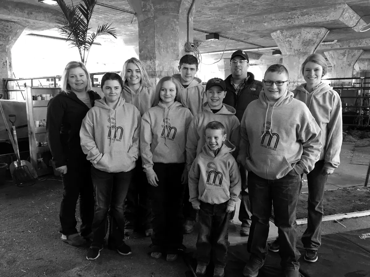 A group in SM Show Steers sweatshirts
